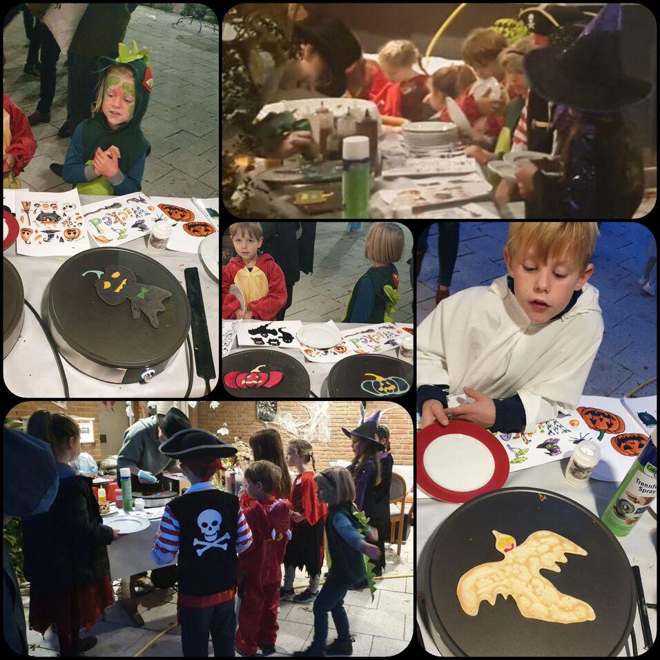 Gruppe von Kindern in Kost&uuml;men, die an dekorierten Tischen Halloween-Pancakes und Malarbeiten anfertigen.